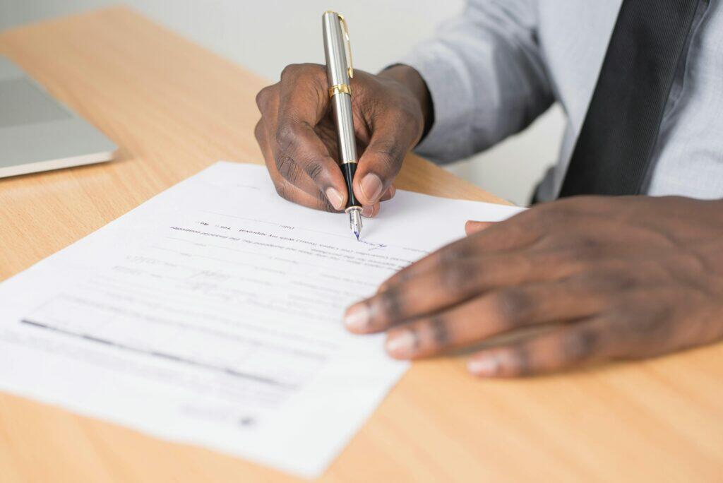 Person signing ACL license application. Demonstrates organizational competence.
