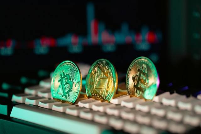 Bitcoin and Ethereum coins on a keyboard, reflecting crypto market trends.