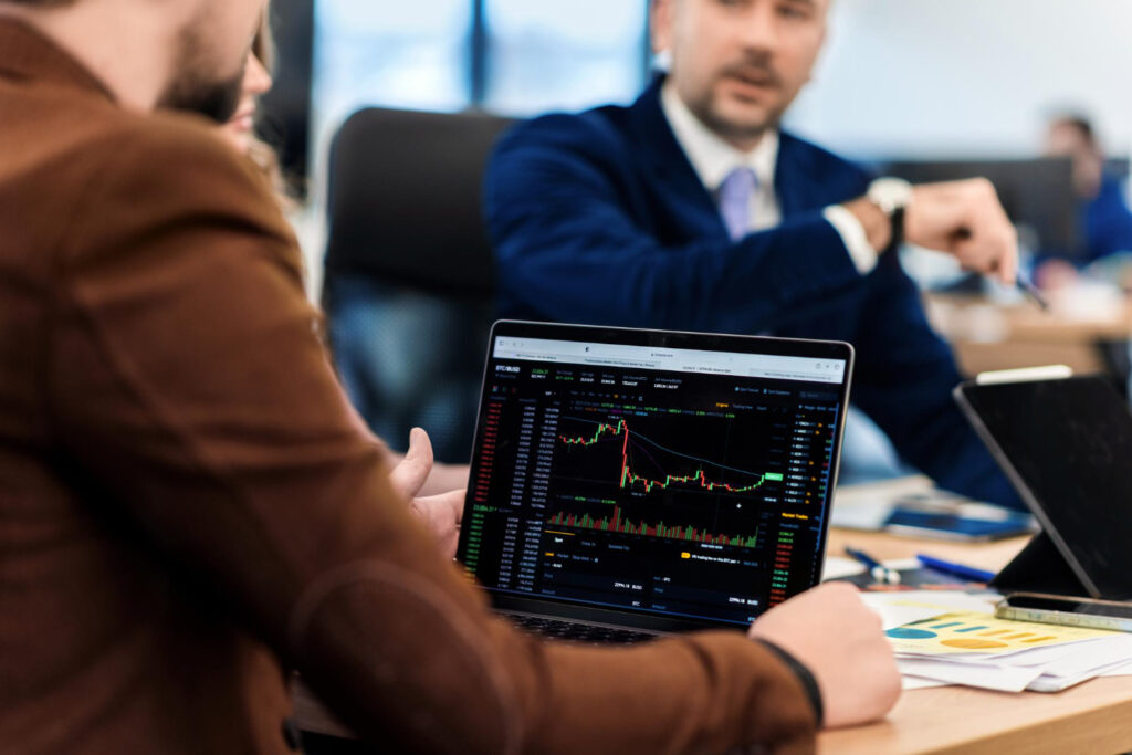 Brokers review ASIC regulatory changes for margin FX and CFD trading on laptop